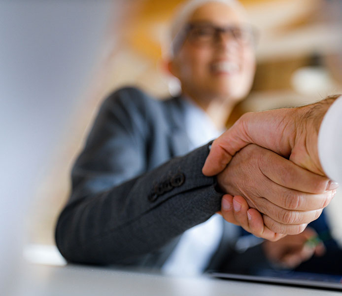 business woman shaking hands to seal a promise