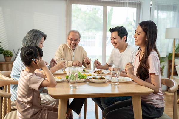 family gathered for lunch at the kitchen table